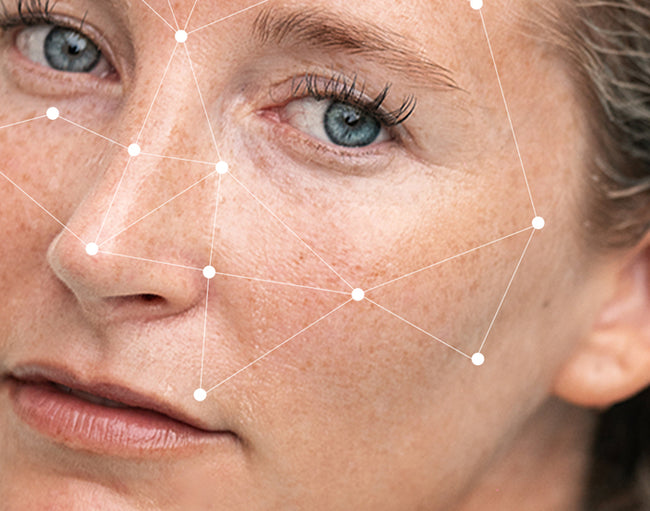 Close-up of a woman's face with geometric lines overlaying it